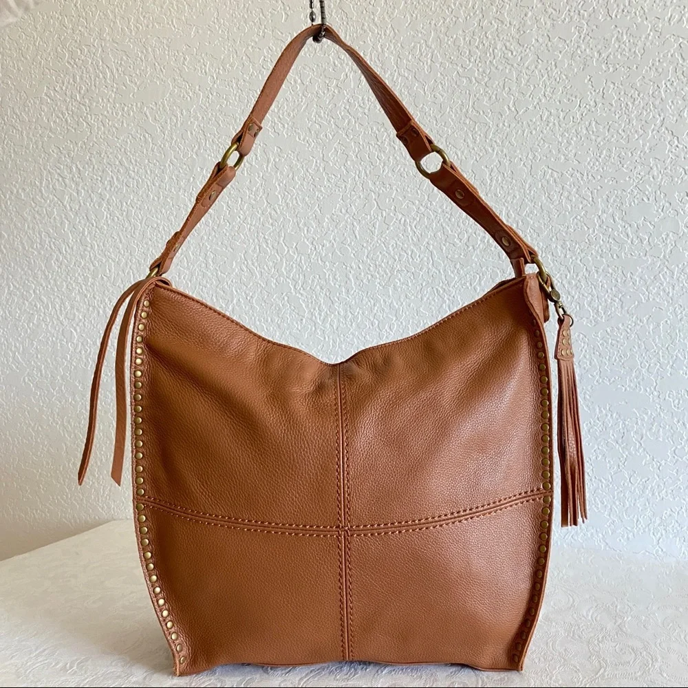 The sak brown leather studded hobo bag